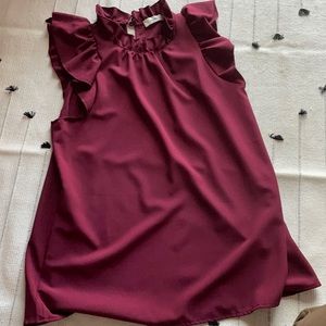Sleeveless with ruffles blouse.